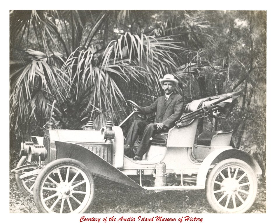 Dr. William Theodore Waas at the wheel of an early automobile on Amelia Island