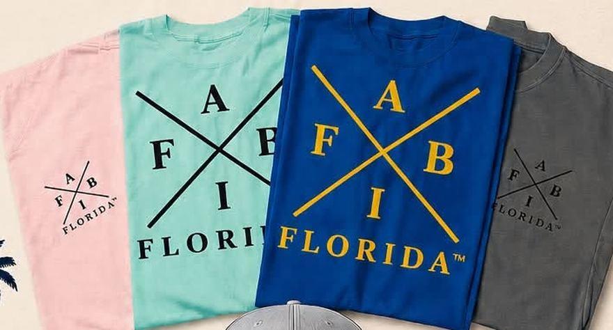 A I F B Florida t-shirts in pink, mint, blue and charcoal, folded and stacked