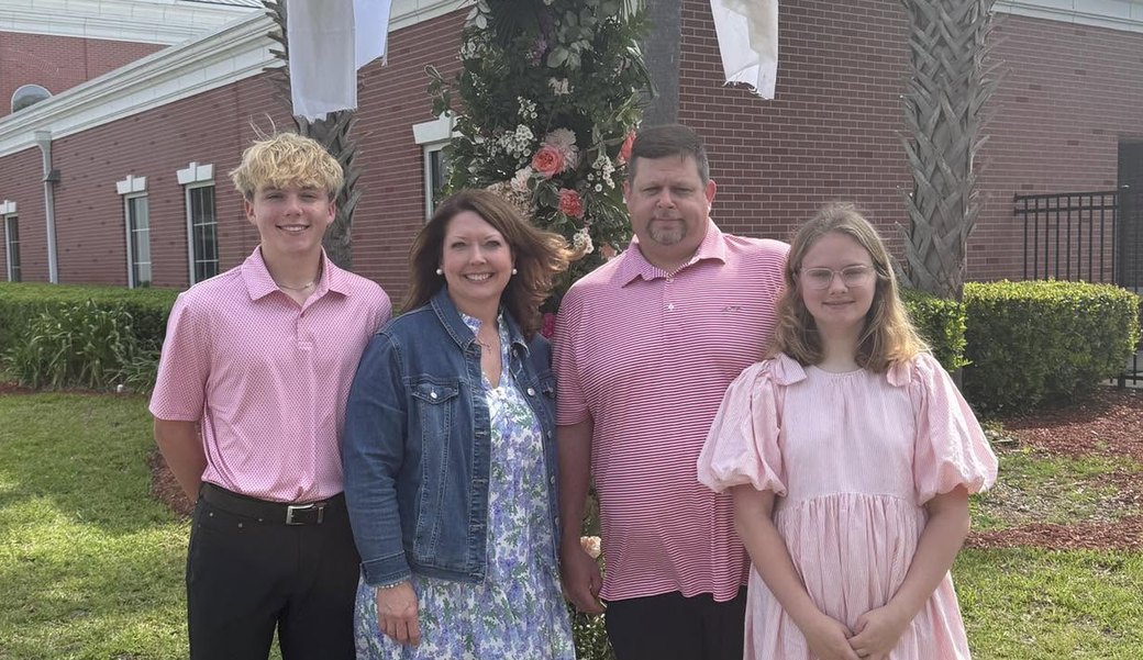 Katie and Ryan Kotopka with their two children outside their church
